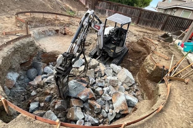 rock hammer breaking boulder