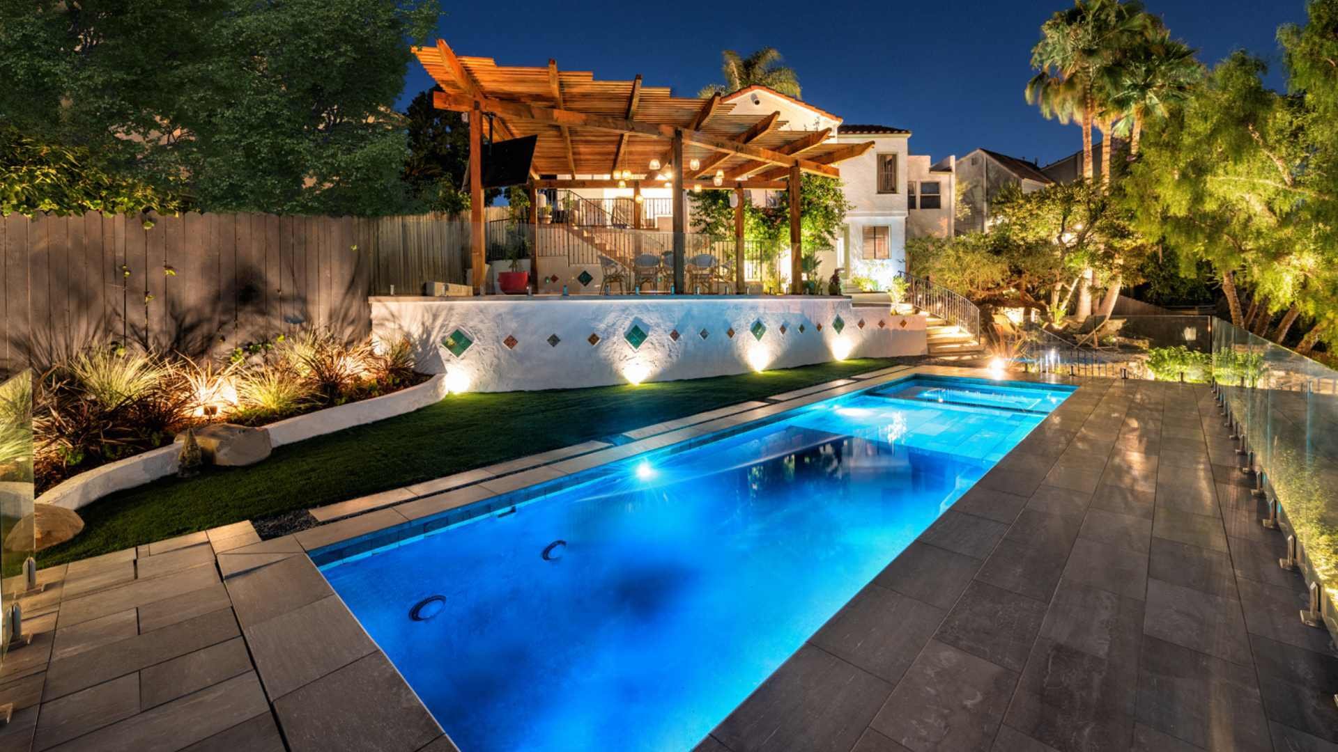 Night view of the modern pool and pergola in Silver Lake,