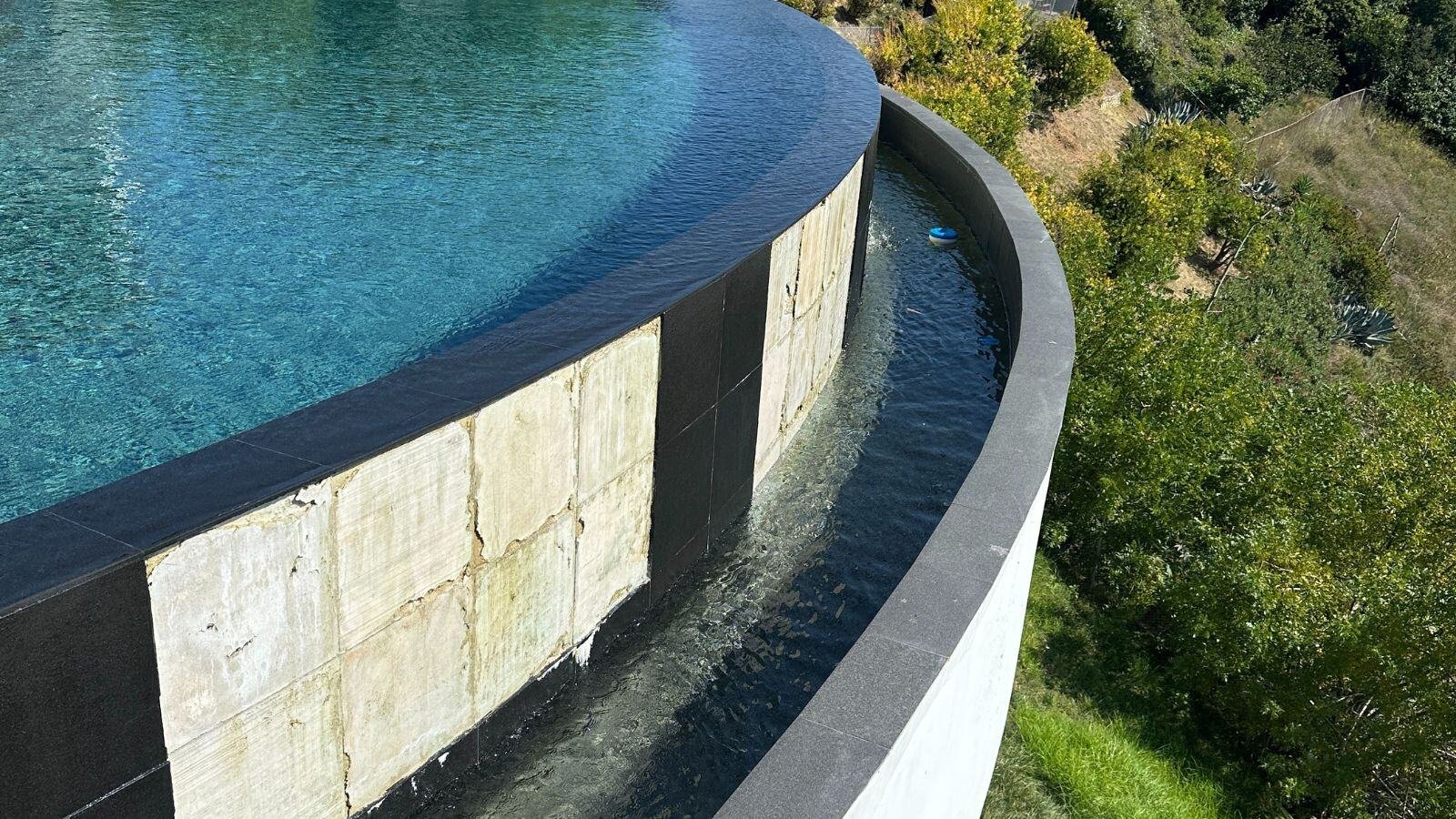 Common pool tile failure