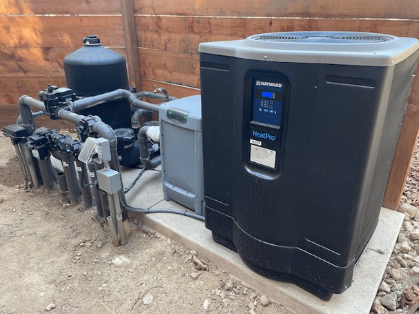 photo of residential pool equipment with hayward heat pump
