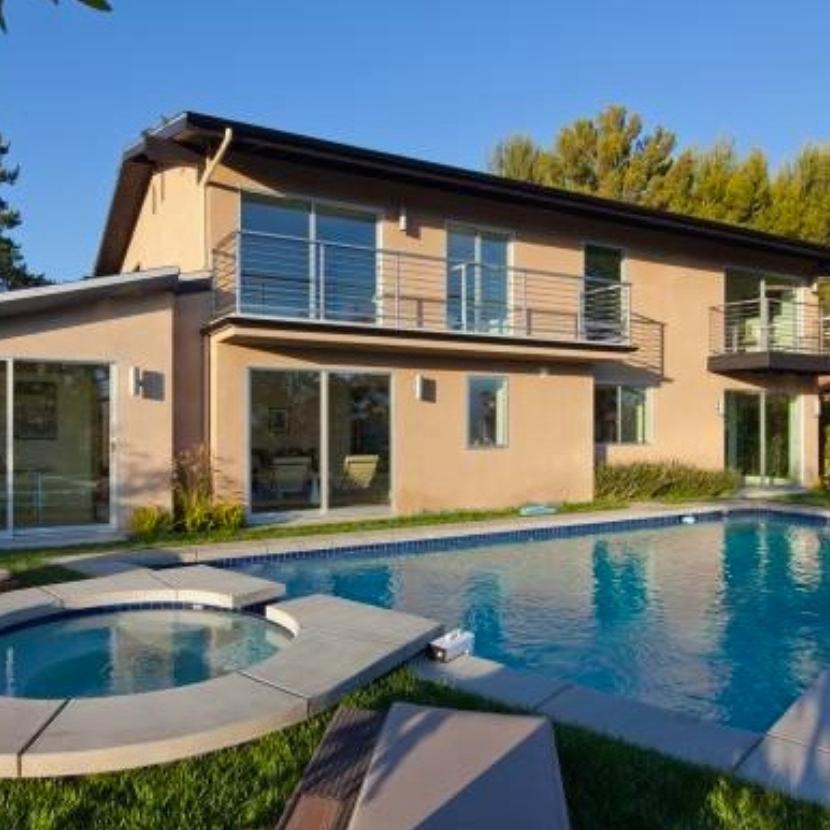 The property has a swimming pool and a raised spa, both of which are accompanied by pour-in-place bullnose coping.