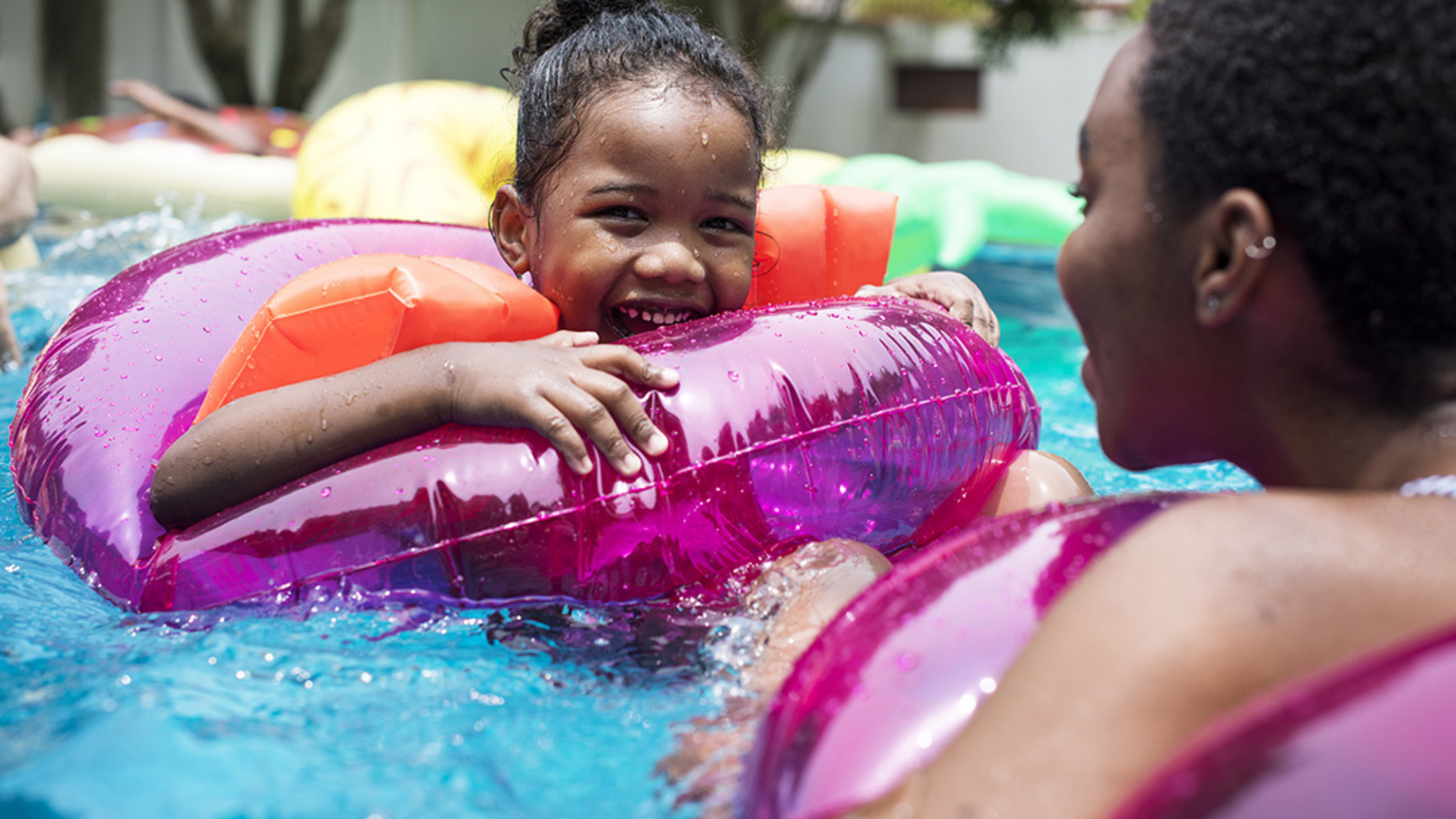 view of freeform pool, 3D rendered design, buildertrend homescreen example, freeform pool surrounded with grass, mom and daughter playing in the pool